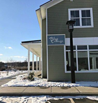 Blue Cottage exterior -- we're located behind Kinney Drug and Bristol Bakery in Hinesburg, VT.