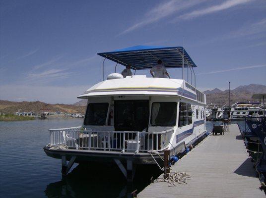 Custom Party top on houseboat. Aluminum frame. Cover made with Sunbrella marine fabric.