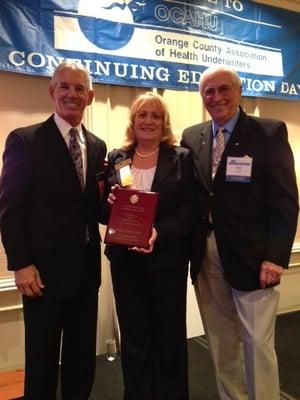 William Flood presenting National Flood Award for Public Service to Rhett Bray OCAHU President and Pat Stiffler, Past Preside...