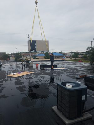 Setting new roof top units in Antioch Il