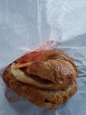 I couldn't taste the difference between the egg and the bacon on this croissant sandwich.