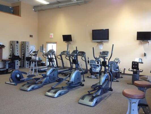 Cardio area includes ellipticals, treadmills, and stationary bikes