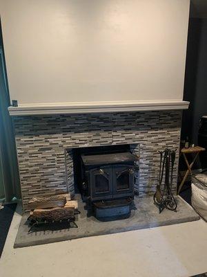 Tile work on a wood stove install.