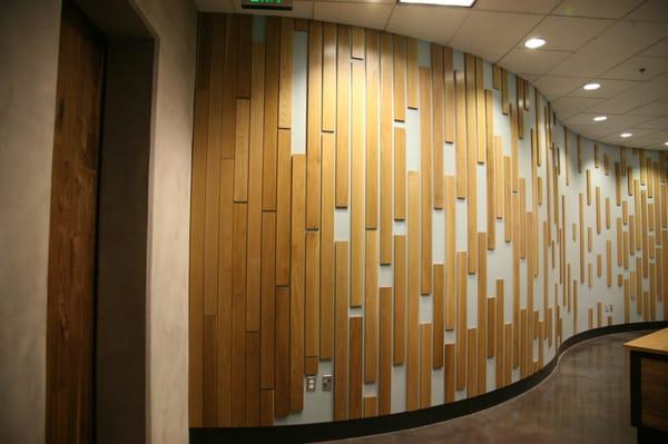 Custom design & installation of entry feature wall in professional office space. Complete interior design by Fix Studio.