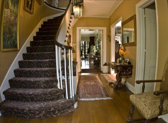 Main staircase and French doors leading to Portico.