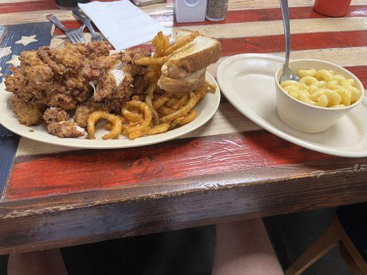 Large chicken strip combo, curly fries and Mac and cheese