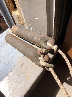 Window weights tie to the sashes and help open and close them