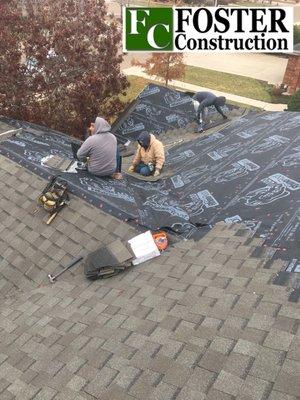 Hard at work on a shingle roof in Portales, NM