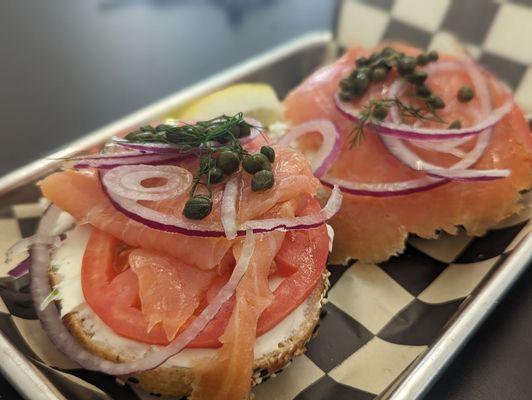 Lox on a toasted everything! Bagel with cream cheese, dill capers red onions and tomatoes.