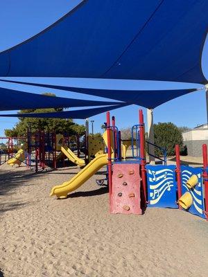 A necessary convenience to have a canopy over the children's colorful playground.