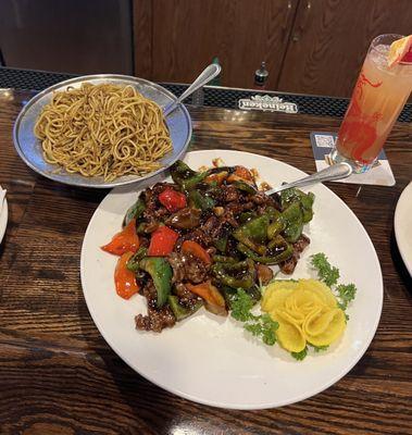 Pepper beef with tomatoes w/ a side of pan fried noodles. Absolutely delicious.