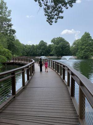 A bridge going around the pond