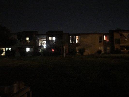 One side of apts across the lawn. No. Lights. It's been like this for over six months!!!