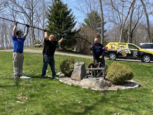 The team from Busy Bee replacing our dead water well pump!