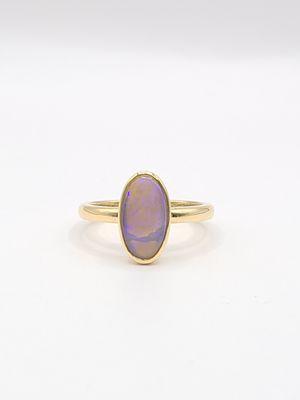 Custom designed opal ring in 18kt yellow gold.