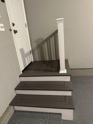 Small deck for house entrance from garage