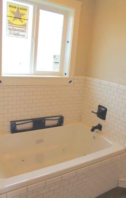 Tile bathtub surround.