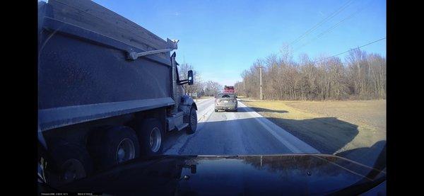 Truck with not enough room going over lane