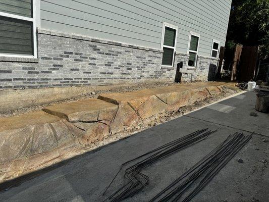 Concrete pathway and retaining wall