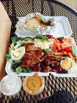 Greek salad w/ Gyro meat, tzatziki and balsamic vinaigrette on the side, warmed pita (kept warm for you in foil) - fresh and tasty.