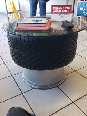 Table made out of tire/rims, nice.