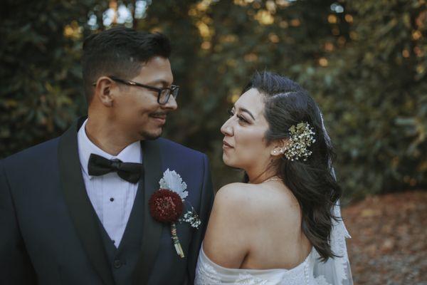 My husband wanted his boutonniere to stand out and match my bridesmaids so, we found this beautiful flower from the daisy family.