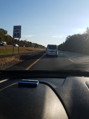 School bus traveling at 90 mph in a posted 65. Multiple marked lanes violations, and failure to signal.