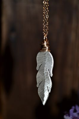 Handmade silver feather necklace.