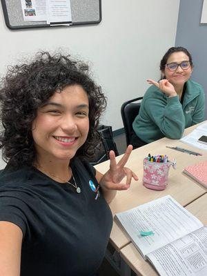 Ms. Andrea in class with a student from Ecuador.