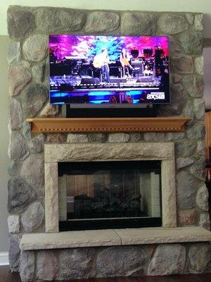 TV Mounted on Stone with SONOS Playbar