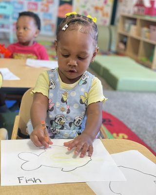 Our one-year-olds learning to color and hold a crayon