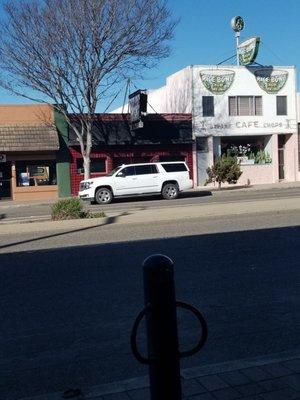 Michael's blocked by white SUV. Note hitching post for horse in the foreground from yesteryear.