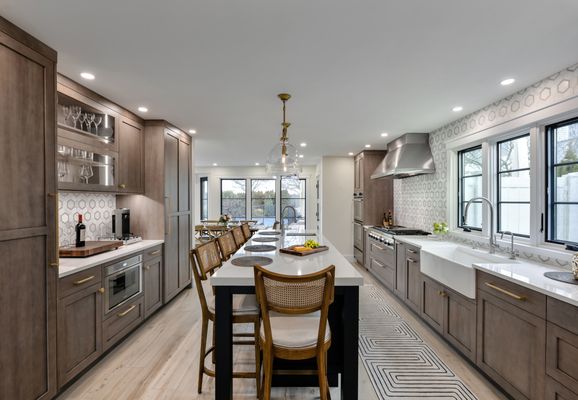 Custom Rutt kitchen, brass hardware, open to dining and living areas. Long kitchen island. South Shore Long Island , NY