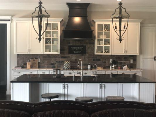 Farmhouse kitchen with custom wood hood