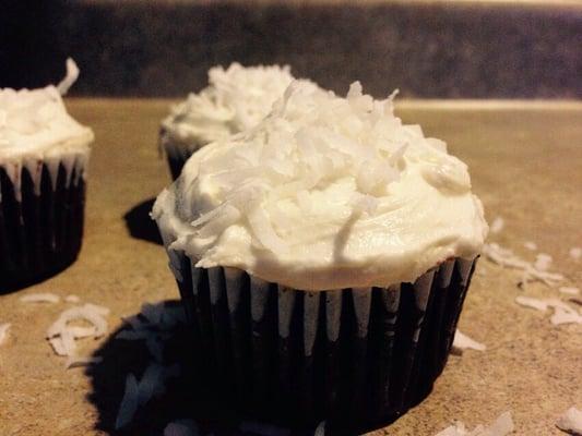 Dark chocolate cake with almond joy coconut filling, creamy coconut frosting and shredded coconut on top!