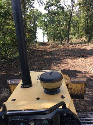 Experienced dozer and backhoe service for land clearing, commercial and residential construction, and sewer and water utility installation.