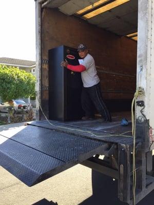 Undamaged safe being loaded on the DHE truck.