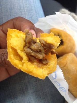 A piece of the beef empanadas