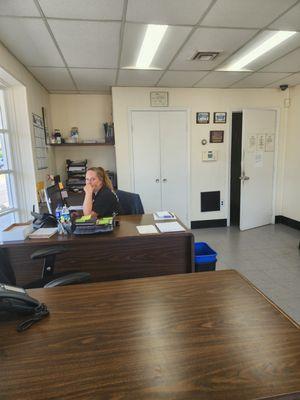 This is employee and it shows door off to the side of her desk where the signs are located which she never pointed out this morning