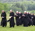 Monks processing through the beautiful grounds