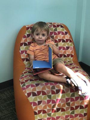 Reading his train book