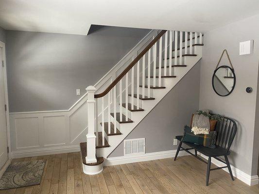 Stairway Remodel. New wainscot, railing and spindles. Painted and stained