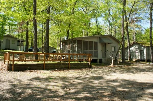 B Cabin.  Sleeps 6.  1 full size bed, 1 bunkbed inside and 1 bunkbed on the porch outside.  $75.00 up to four occupants.