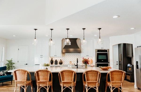 This kitchen remodel was a total reconfiguration, including the removal of a wall and the addition of the oversized island.