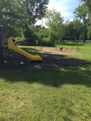 A slide and swings right off the pavilion. It rained hard a few hours prior.