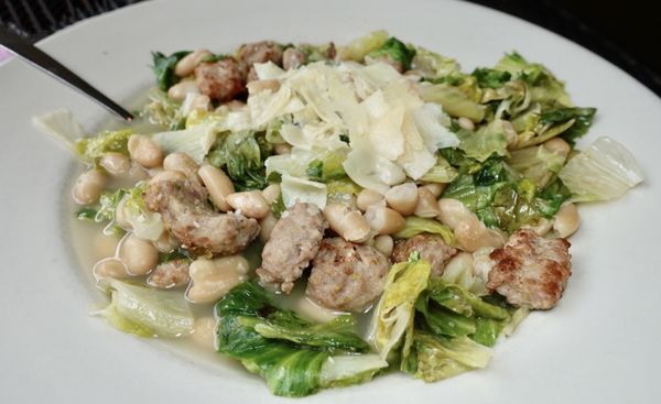 Beans and greens with sausage pieces