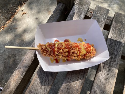 Seoul hotdog (#1) with hot cheeto crust, ketchup and honey mustard on top