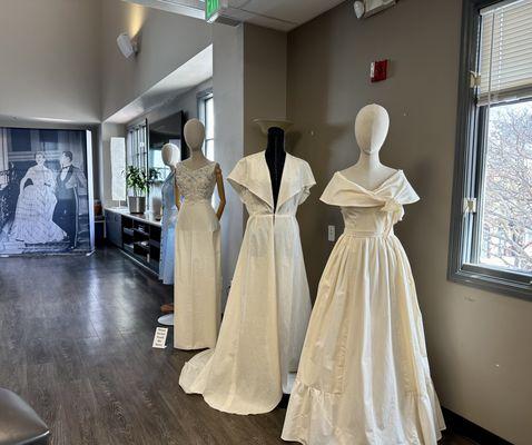 Row of toiles during Coronation Couture exhibition