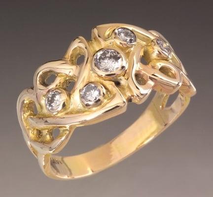 Celtic inspired design with Diamonds. 14 karat gold