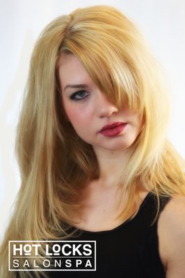 Beautiful Blonde color and textured long layered cut.